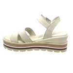 These soft and comfortable leather flatforms have support and style with their Y back, leather covered buckle and neutral striped wedge.