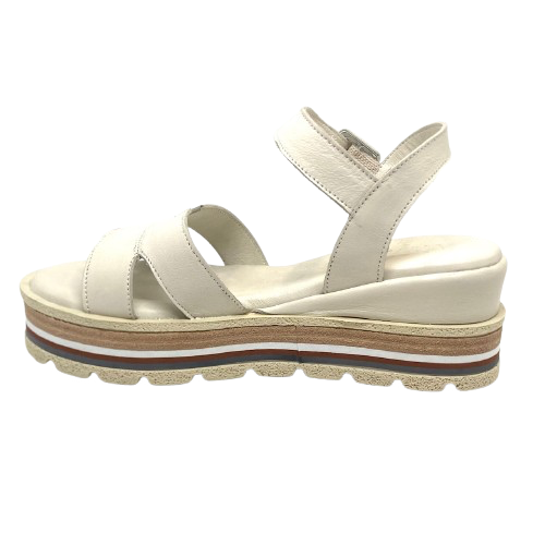 These soft and comfortable leather flatforms have support and style with their Y back, leather covered buckle and neutral striped wedge.