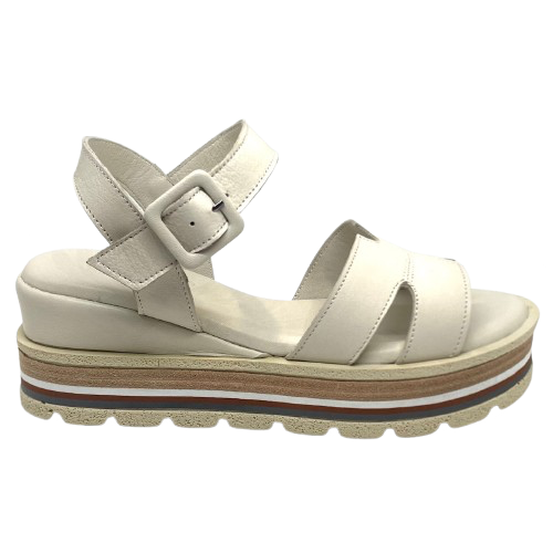These soft and comfortable leather flatforms have support and style with their Y back, leather covered buckle and neutral striped wedge.