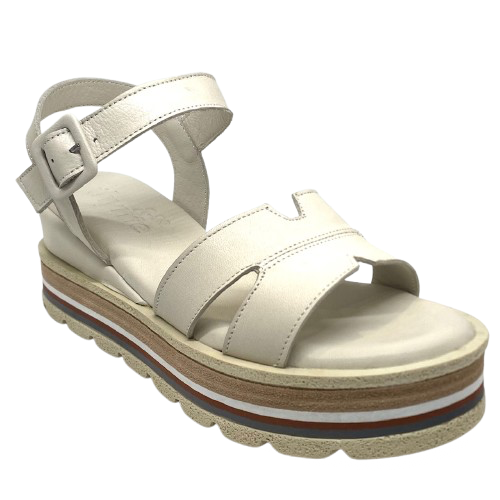 These soft and comfortable leather flatforms have support and style with their Y back, leather covered buckle and neutral striped wedge.
