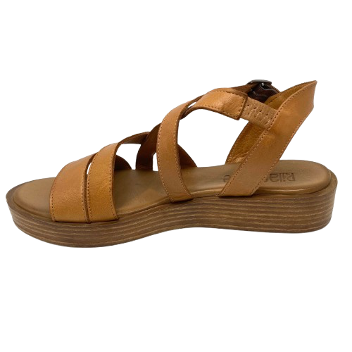 An everyday little tan sandal that will soon become a favourite go to. Made on a low wedge with a cushioned sole by Rilasarre.
