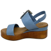 Blue denim leather and a striking leather covered buckle in silver make this little wedge stand out from the crowd. The base of the wedge has a dark tan stacked leather effect. Brand is Rilassare.