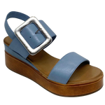 Blue denim leather and a striking leather covered buckle in silver make this little wedge stand out from the crowd. The base of the wedge has a dark tan stacked leather effect. Brand is Rilassare.