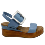 Blue denim leather and a striking leather covered buckle in silver make this little wedge stand out from the crowd. The base of the wedge has a dark tan stacked leather effect. Brand is Rilassare.