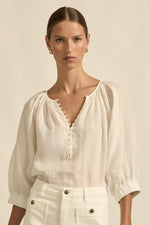 easy yet considered, the tranquil top is a relaxed staple designed for daily wear.

100% ramie
gathered neckline with delicate shell buttons
off-the-body fit offers versatility and ease
raglan sleeve with elastic cuff for styling flexibility
ideal for casual layering and warm weather