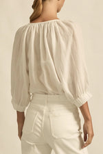 easy yet considered, the tranquil top is a relaxed staple designed for daily wear.

100% ramie
gathered neckline with delicate shell buttons
off-the-body fit offers versatility and ease
raglan sleeve with elastic cuff for styling flexibility
ideal for casual layering and warm weather