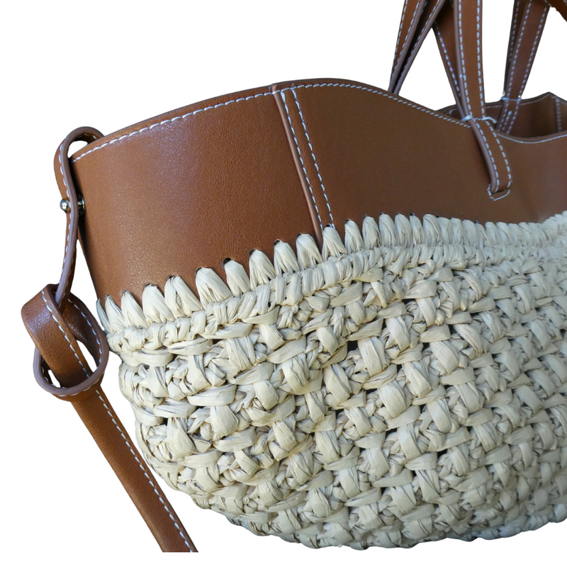 This gorgeous raffia and tan leather bag certainly makes a statement! A practical everyday bag with wow! It has two double straps so can be used as a grab bag or shoulder bag. A drawstring inner, as well as a magnetic clip, means all your goodies are kept safe and sound. Measures 53cm x 23cm