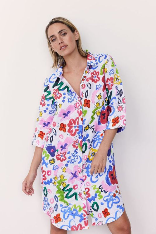 This bright "hand painted look" floral print on 100% linen is perfect in this simple shirtmaker style. And yes, it has 3/4 sleeves and pockets!