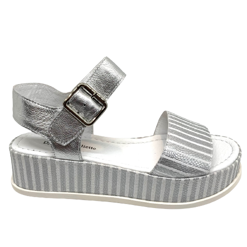 Elevate you casual style! When you need to be dressed but still want the comfort a flat shoe gives then these metallic sandals are perfect. The striped silver leather of the soft wide strap across the toe is repeated in the platform and the Y back is in plain silver leather. Made by Django and Juliette.