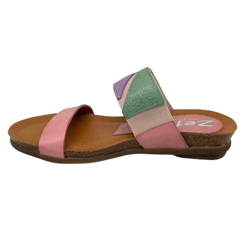 This pretty pastel multi slide has a contoured footbed and suede lining. The strap across the instep is elasticized with patches of leather for comfort on the highest of arches. The cushioned sole means this little slide is bound to become a summer favourite. Made in Spain.