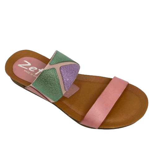 This pretty pastel multi slide has a contoured footbed and suede lining. The strap across the instep is elasticized with patches of leather for comfort on the highest of arches. The cushioned sole means this little slide is bound to become a summer favourite. Made in Spain.