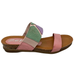 This pretty pastel multi slide has a contoured footbed and suede lining. The strap across the instep is elasticized with patches of leather for comfort on the highest of arches. The cushioned sole means this little slide is bound to become a summer favourite. Made in Spain.