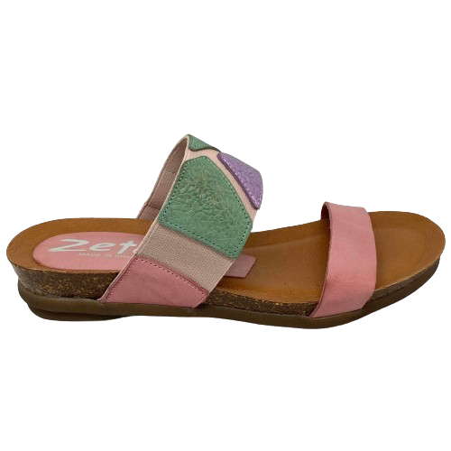 This pretty pastel multi slide has a contoured footbed and suede lining. The strap across the instep is elasticized with patches of leather for comfort on the highest of arches. The cushioned sole means this little slide is bound to become a summer favourite. Made in Spain.