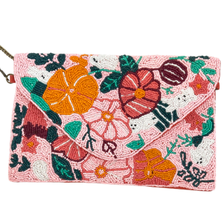 Beaded in pink-coral-orange and hints of green this little enveloped shaped clutch has a brass chain strap, rust coloured canvas back and measures 25cm x 17cm.