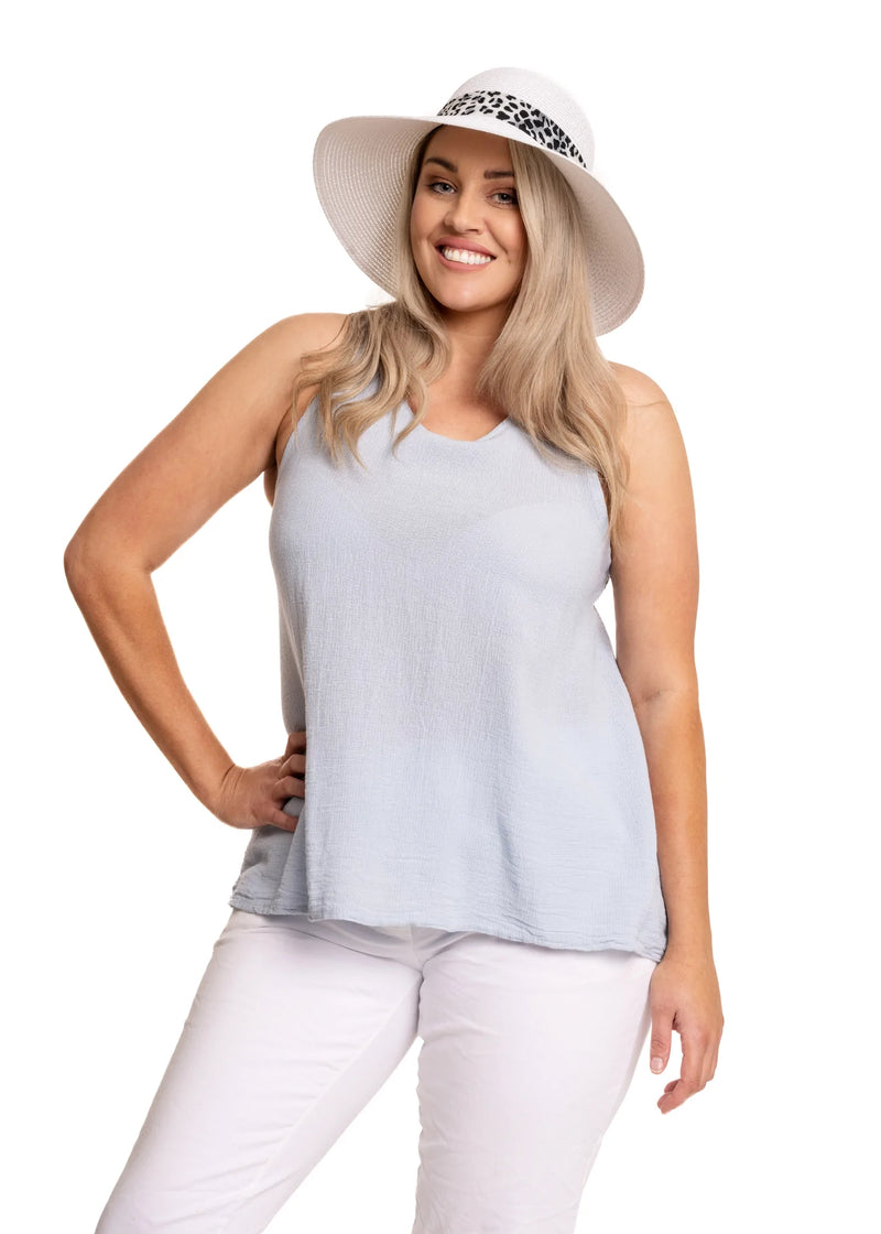This is a stunning wee top, particularly if you enjoy sleeveless. It's also lightweight in a quality Italian linen and cotton open-weave fabric. The Alina Top offers a round neck with a teardrop opening at the back secured by a small button. The back is longer than the front with a curved hemline. Delightful!  Material - 50% Linen / 50% Cotton  Made In Italy