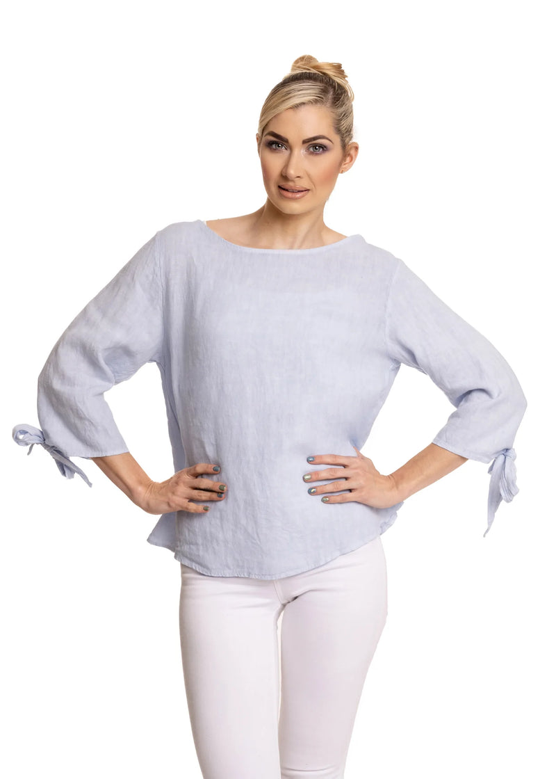 If you love a stylish, simple look, The Freya Top is for you. Elbow length sleeves with a gorgeous linen tie at the edge. Round neck. The top is finished with a slightly swing shape. This top will be perfect with any bottoms this season. Lightweight for the warm weather to come.  Material - 100% Linen  Made In Italy