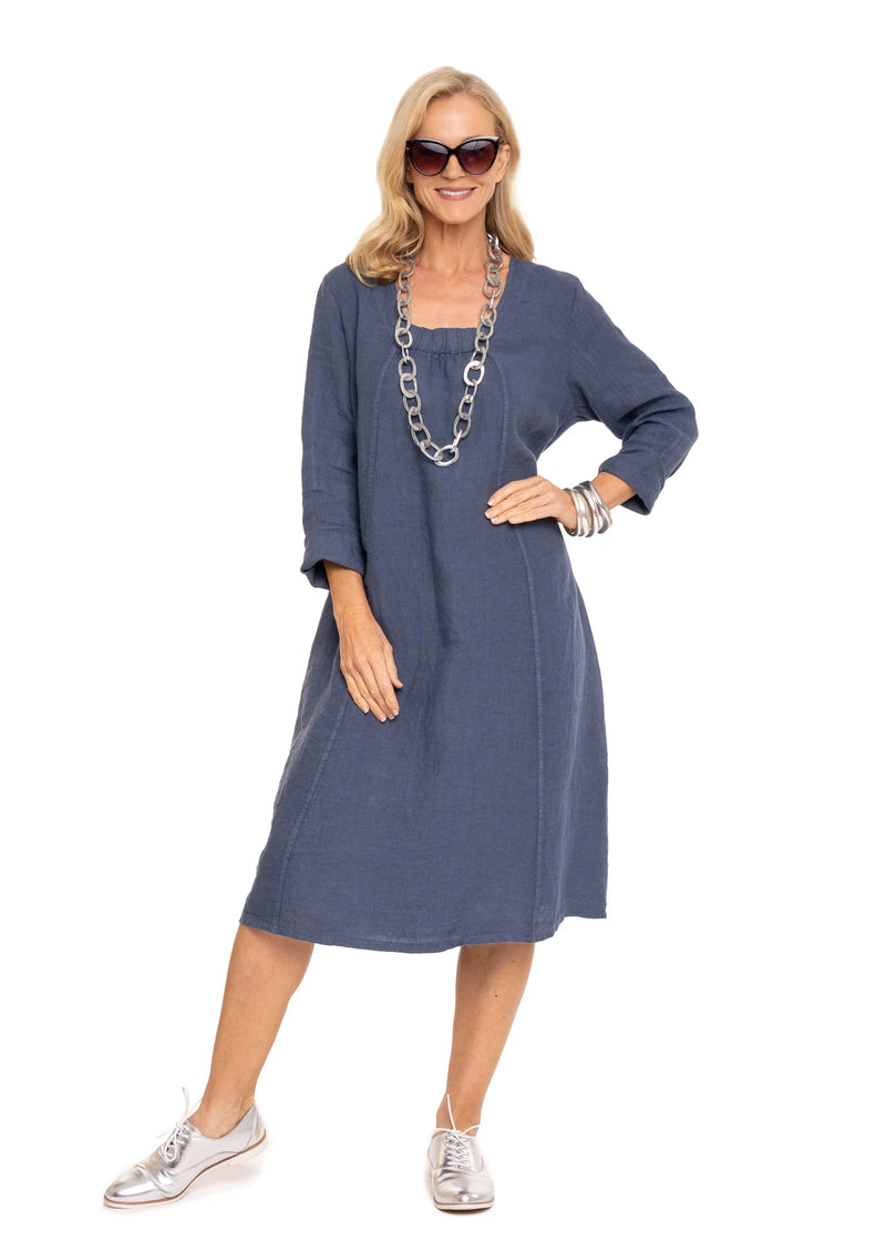 Adorable long sleeved linen dress with a square neckline with slight gathering.  A panel of stretch ribbing on the back of the arms and down the sides of the back of the dress for ease of movement.  Perfect dress for dressing up for that special occasion or down for everyday wear.  Material - 100% Linen  Made In Italy
