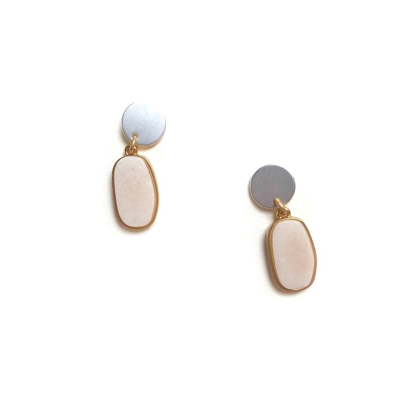A very pretty drop earring with a matt silver button at the ear and a gold oblong drop with a pale blush stone.