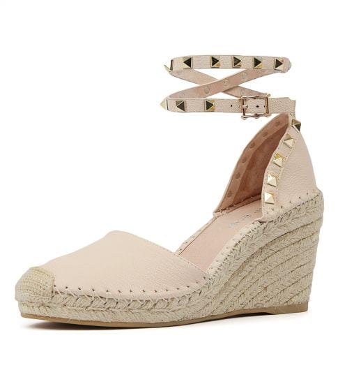 Leather, wedged espadrille with a closed toe, wrap ankle strap with studs, crochet toe and blanket stitching. Wedge is 8cm with 2cm platform. Colour nude.