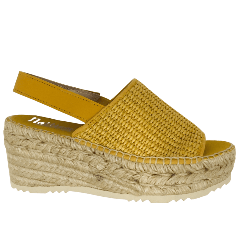 920 × 1920px  Wedged Spanish espadrille with woven elasticated rafie upper and rope wedge. Sling back offers support. Colour mustard.
