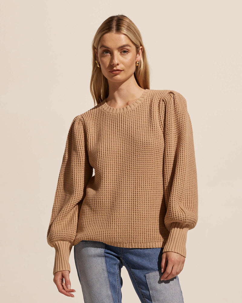 This textured cotton knit is perfect for trans-seasonal dressing. Made for layering and perfectly paired over a feminine shirt. The Basis offers a relaxed-fit body with feminine blouson sleeves finishing in a deep ribbed cuff. Colours picked straight from nature's palette.    