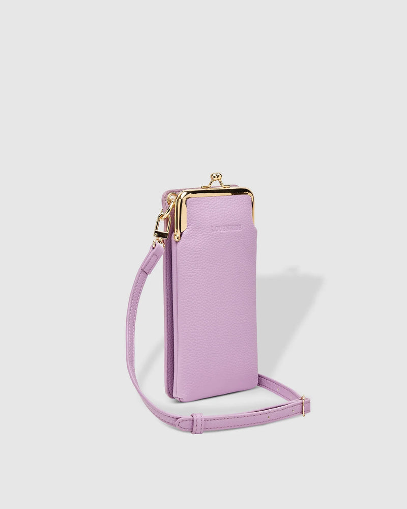 The Louenhide Billie Crossbody Bag is a fun, no fuss phone bag, perfect for the minimalist. Designed for style and functionality, this compact crossbody will carry your phone, cards and money with ease, without weighing you down. Easily inject colour into your favourite cocktail outfits by styling with your Billie Crossbody. Now available in a range of summer pastels and brights, this affordable accessory is a must have for party season.