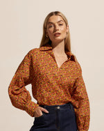 This best-selling piece is a romantic play on both the masculine and the feminine. A flattering slightly oversized fit is feminised with a drop lantern sleeve, a v neckline and slightly splayed collar. The bounty is your everyday go-to for the modern romantic.     easy-fitting and flattering style v-neck with 70’s inspired collar covered buttons at sleeve perfect for the modern woman