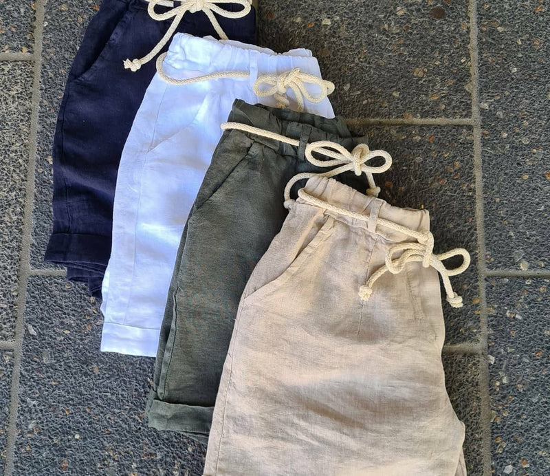 The perfect summer short is here!  Gorgeous linen with two front pockets, a faux pocket on the back, cuffed legs, elasticated waist and a rope style tie.  Bring on the warm weather!  Material - 100% Linen  Sizes - SM, ML  Colours   Khaki, White, Latte, Navy  Made in Italy