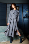 Fabulous striped denim dress with wide wrap around straps crossing at the front to tie at the back. Irregular angled hem line with two splits add to the intrigue of this interesting piece from M.A. Dainty.