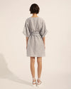The evoke embraces a sense of ease that is perfect for both adventure and unwinding. A wide boxy sleeve balances a simple kaftan silhouette that can be worn with or without the matching belt. Organic inspired embroidery finishes this garment beautifully.      above the knee dress self-tie matching belt floral embroidered details