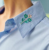 This versatile, relaxed fit, classic shirt is crafted from our breathable light weight cotton. Dropped shoulders, slightly gathered cuffs, chest patch pocket and garden emboidery of "bees", "flowers", "watering can" and "love" placed throughout gives it  the life and colour of Spring. Wear solo as a shirt dress or throw over you favourite denim and white tee.  Composition:  Cotton/elastane