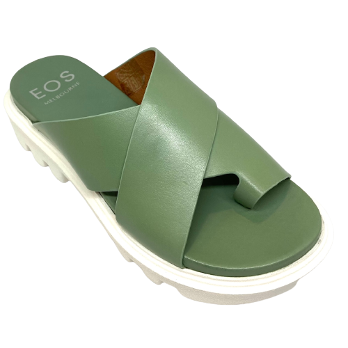 Fligh is a modern toe thong slide on a white chunky "tractor tyre" sole. The soft leather crosses the foot in wide straps and has a toe piece. This comfortable summer slide is available in the beautiful green shade of basil. Made by EOS.