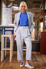 The polished yet relaxed feel of the Lark pant makes them versatile from day to night. Cut from flowy check fabric, they're designed to sit high on the waist and have straight legs with pleats for added volume. Show off the cropped hem with sneakers or loafers. Style yours with a T-shirt or blazer.  Composition: Polyester/Viscose