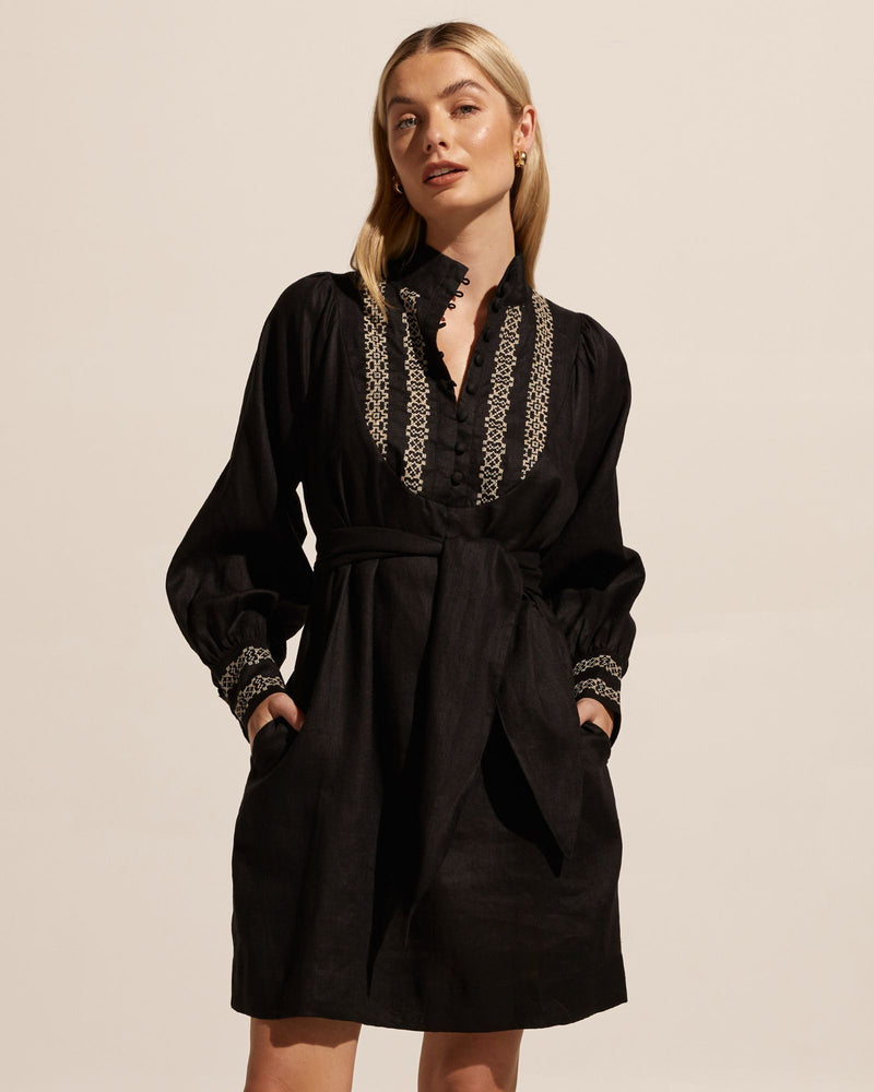 Think of the Narrate as your winter take on a kaftan. Cut in a quality linen with geometric embroidery this effortless piece channels a worldly timeless aesthetic. A slightly off the body cut ensures a flattering fit. A u-shaped yoke lends a feminine edge and covered buttons provide a polished finish. Team yours with a knee-high boot for on-point autumn style.      100% linen regular fit, slightly off the body covered buttons