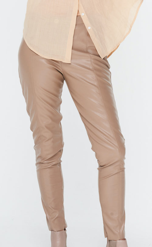 The luxury of leather look pants never wanes.  The feaux fly front make sure these pants sit perfectly across the stomach with side zipper for entry. These pants have stretch for ease of wear and the perfect comfortable fit.  Zoe Kratzmann 