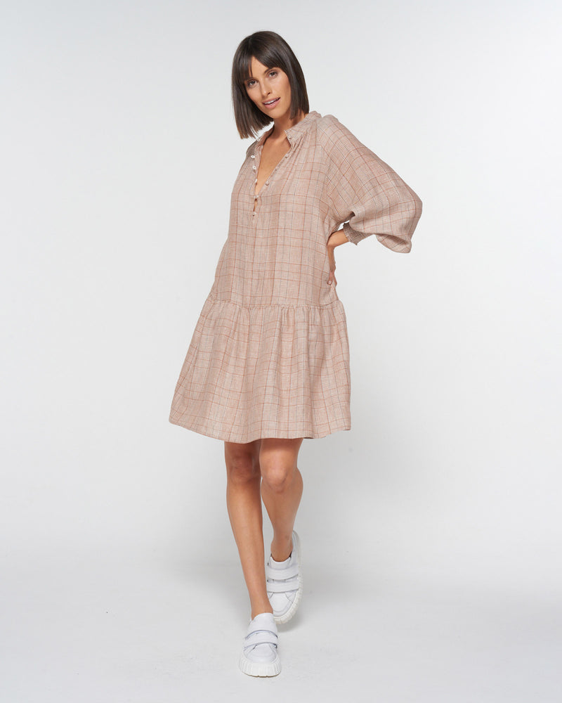 A flattering drop waist and button-down neckline are punctuated with shirring detail on a deep cuff. An ideal choice for everyday style. Sneakers or a heel will both be perfect partners for this piece. Zoe Kratzmann