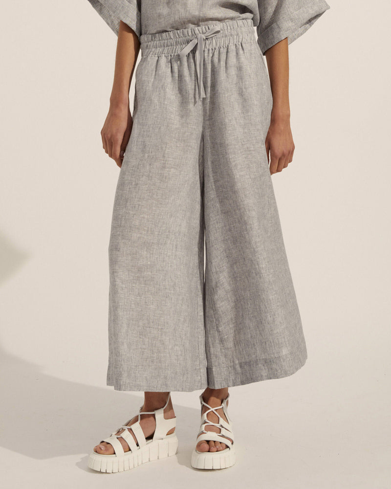 Comfortably chic and quintessentially stylish. These light grey linen pants convey effortless elegance.The cropped length and wide leg fitmean you can pair with flats for a leisurely look or upgrade the look from day to night witha strappy sandal. A gathered drawstring waist flatters every figure, A relaxed fit, with just a hint of tailoring.