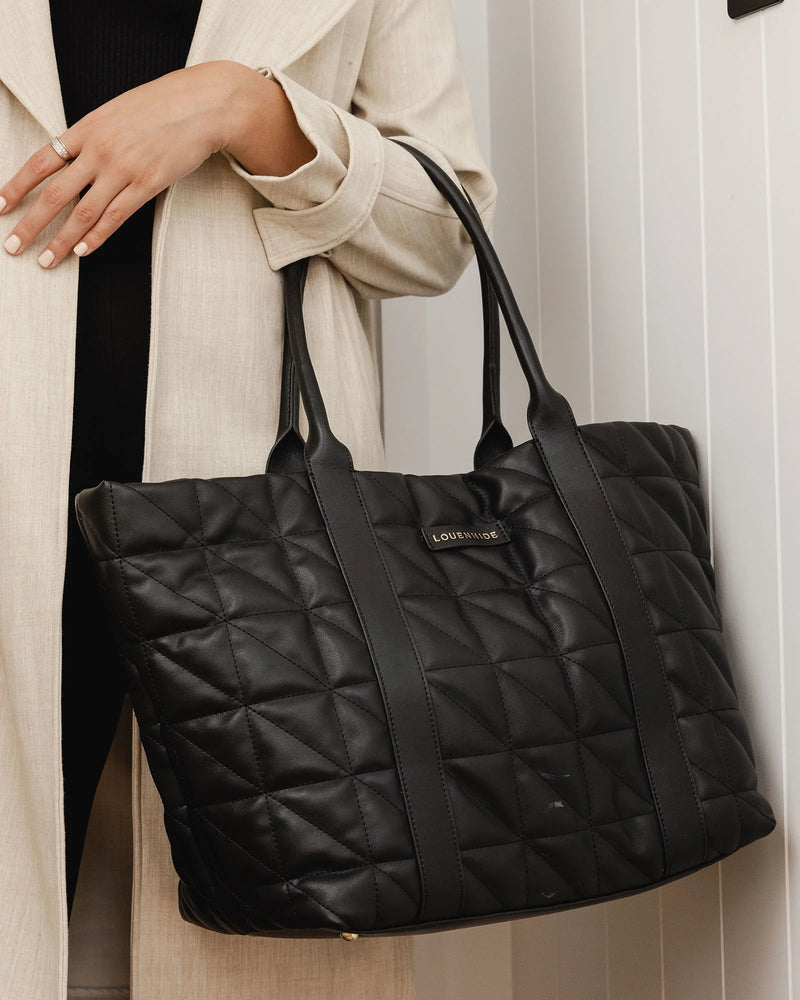 The Louenhide Toronto Black Puffer Tote Bag is a must-have for anyone who wants a stylish and practical way to carry their essentials to work, gym or university. 