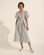Understated yet alluring with a comfortable off the body fit the Unfurl is both modern and feminine. A midi hemline, ruffled neckline and button through style gives you the freedom to wear it as demure, or as daring as you please. This linen blend makes for a great travel companion, while the self-tie fabric belt lets you tailor to your waistline. A ruffled neckline and curved lace trim make this elegant dress ideal for any occasion.  