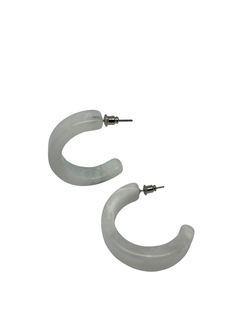 A small resin hoop that is slightly wider and flatter than other small hoops in this range. Available in white or amber.